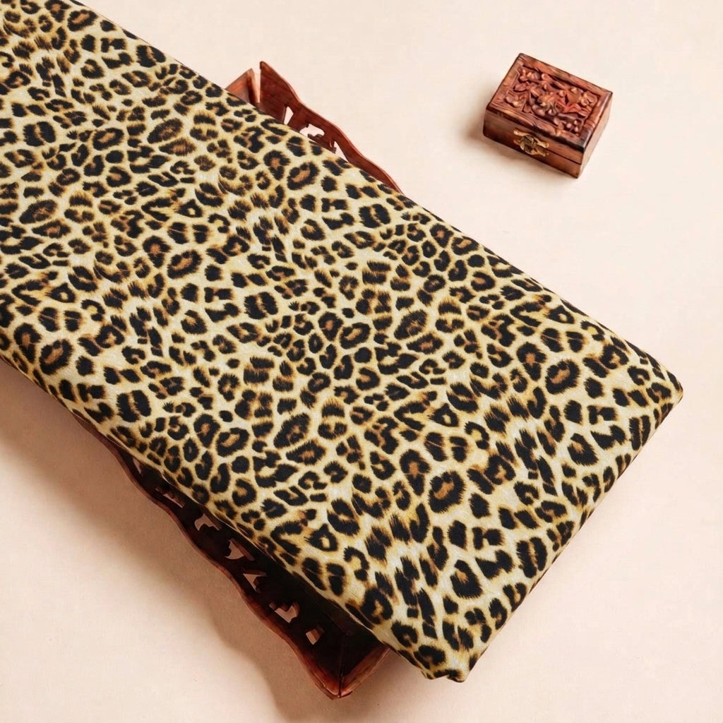 Folded Yellow Animal Print Crepe Fabric Highlighting Texture