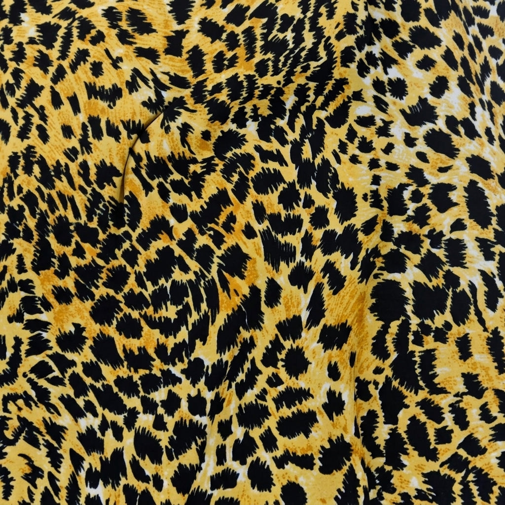 Swirled Yellow Animal Print Crepe Fabric Showing Drape