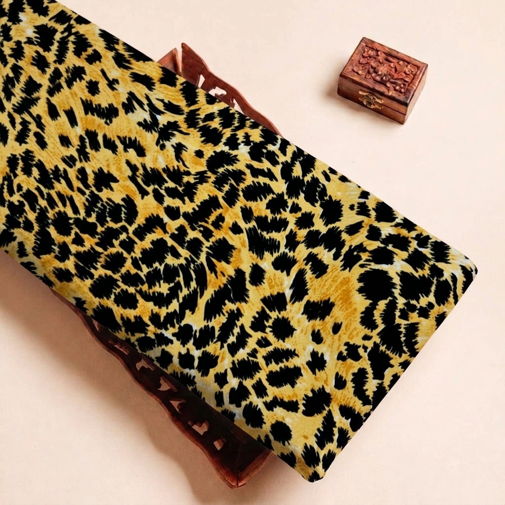 Folded Yellow Animal Print Crepe Fabric Highlighting Texture
