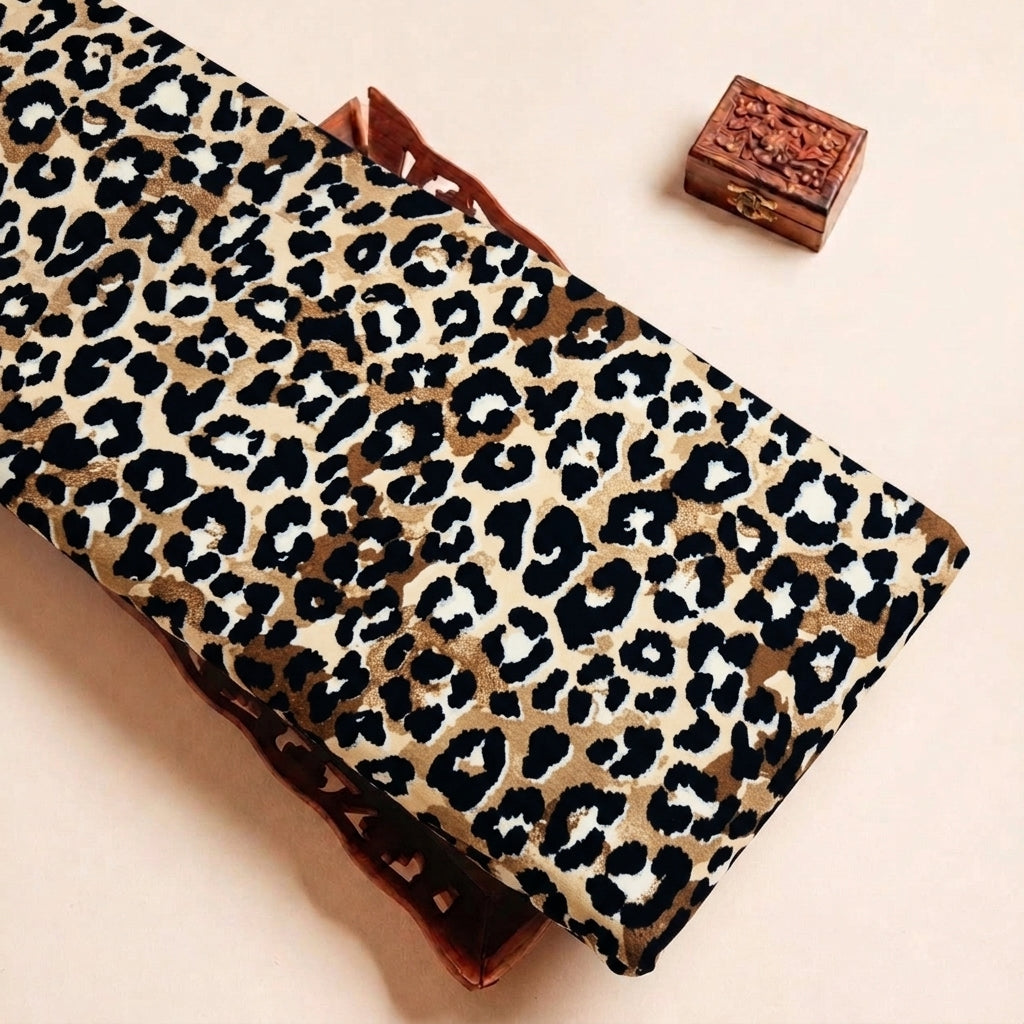 Folded Brown Animal Print Crepe Fabric Highlighting Texture