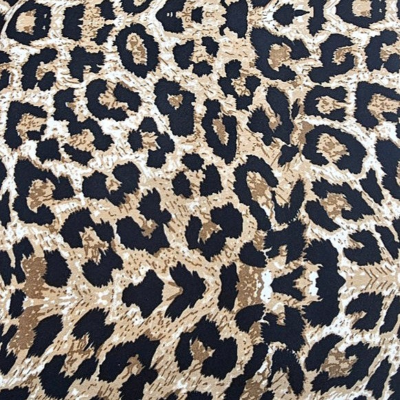 Brown Animal Print Crepe Fabric, laid flat
