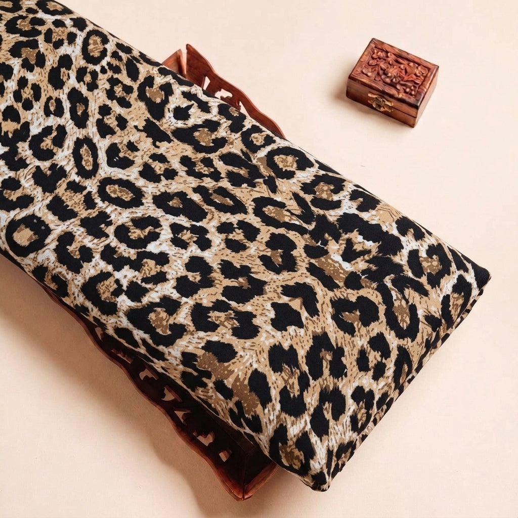 Folded Brown Animal Print Crepe Fabric Highlighting Texture