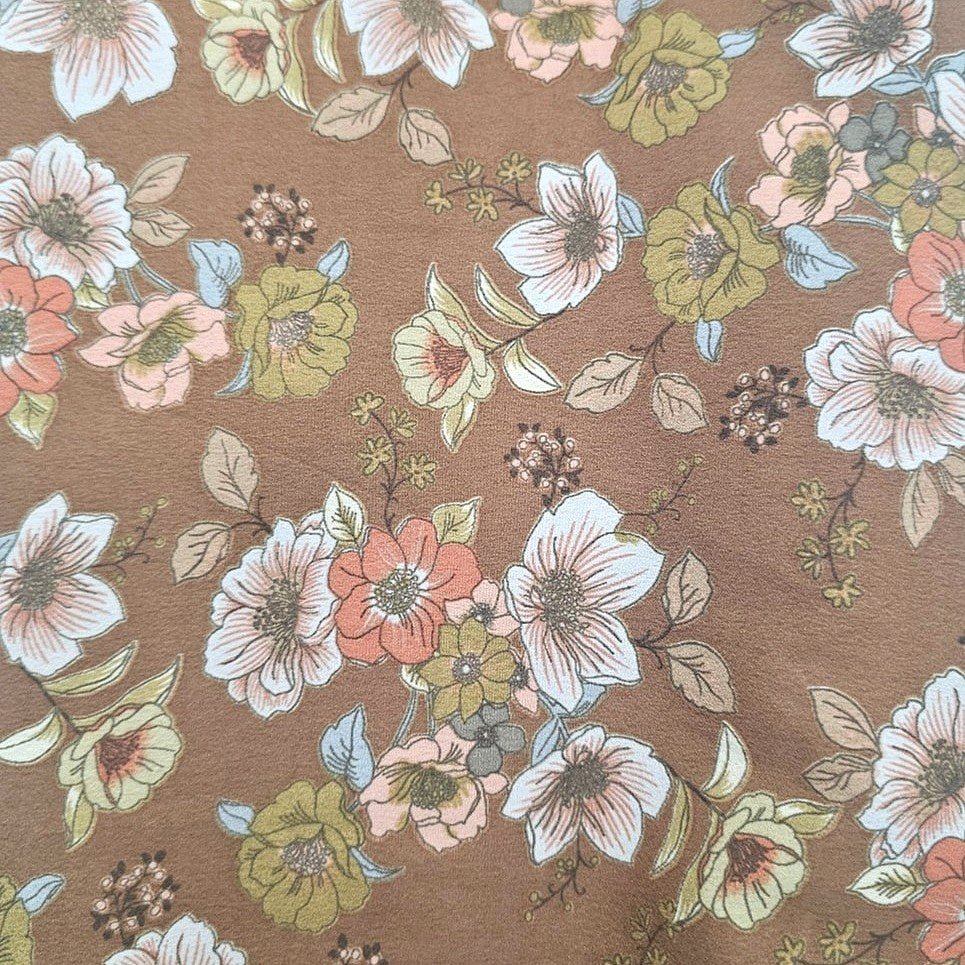 Brown Floral Crepe Fabric, laid flat