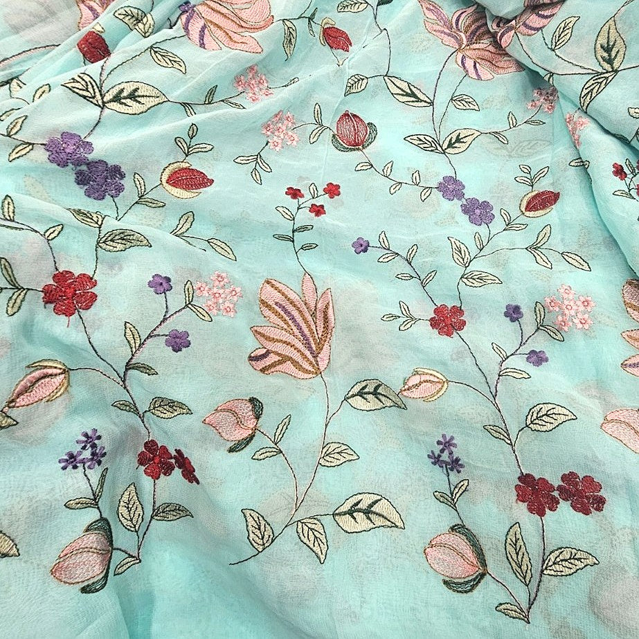 Sky Blue Floral Embroidery Georgette Fabric, laid flat
