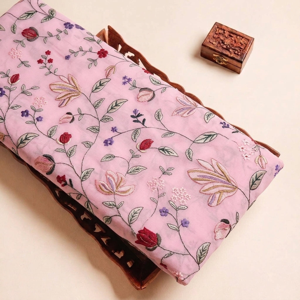 Folded Pink Embroidery Georgette Fabric Highlighting Floral and Texture