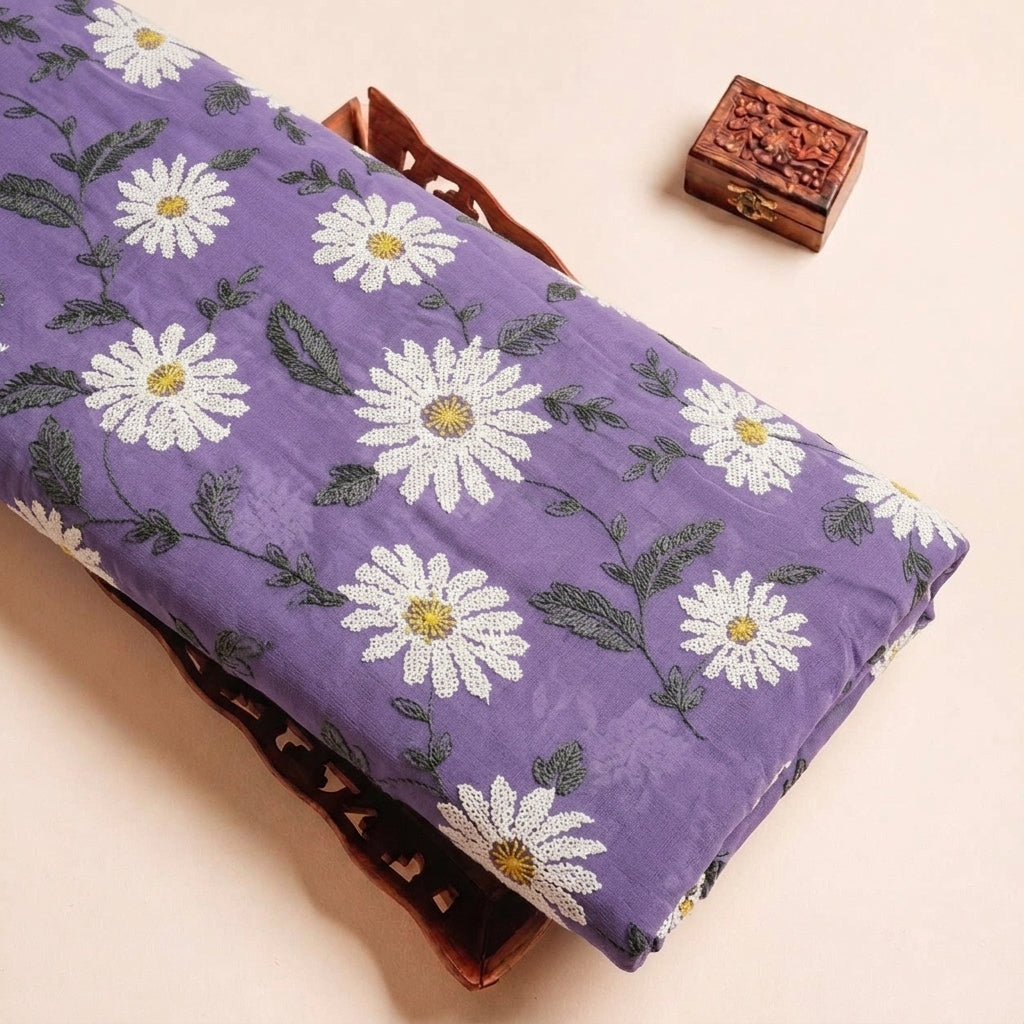 Folded Purple Embroidery Georgette Fabric Highlighting Floral and Texture