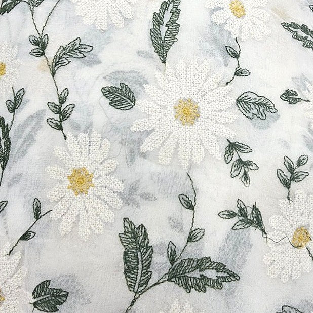 White Floral Embroidery Georgette Fabric, laid flat