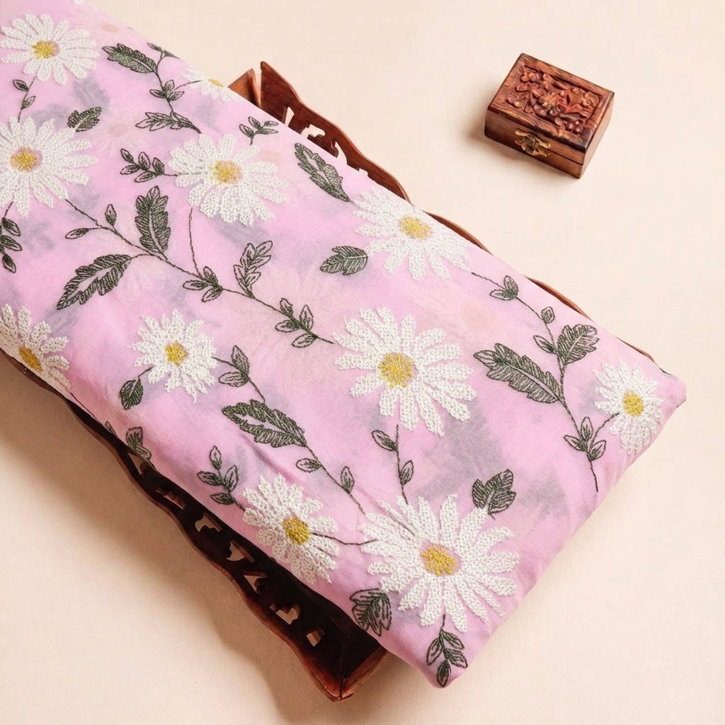 Folded Pink Embroidery Georgette Fabric Highlighting Floral and Texture