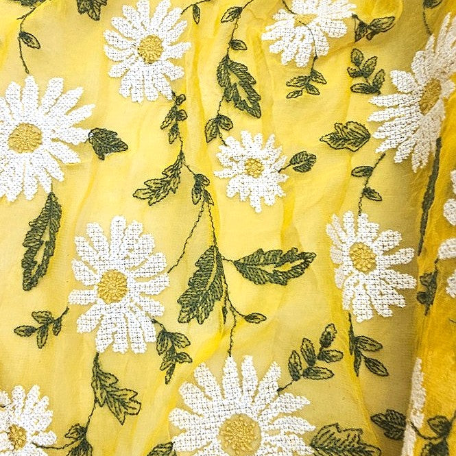 Yellow Floral Embroidery Georgette Fabric, laid flat