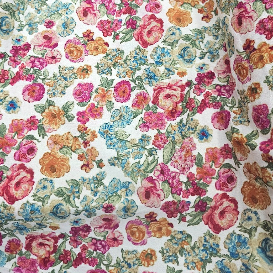Cream Floral Crepe Fabric, laid flat