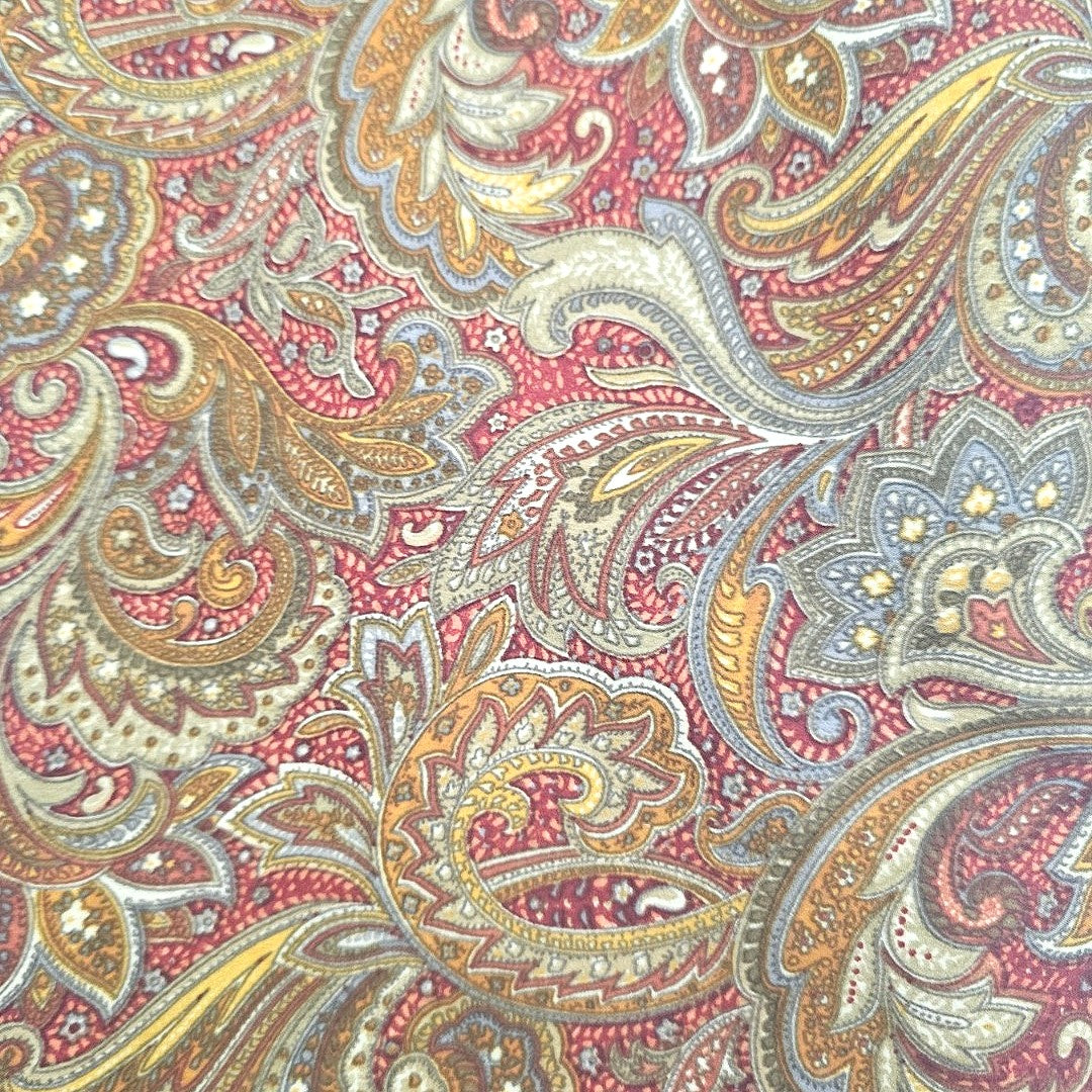 Yellow Paisley Crepe Fabric, laid flat