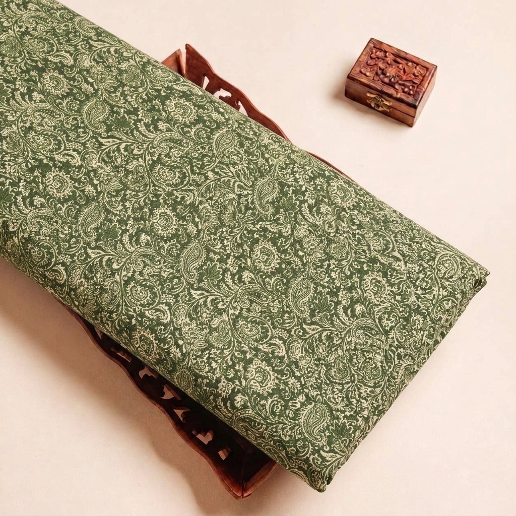 Folded Green Paisley Crepe Fabric Highlighting Texture