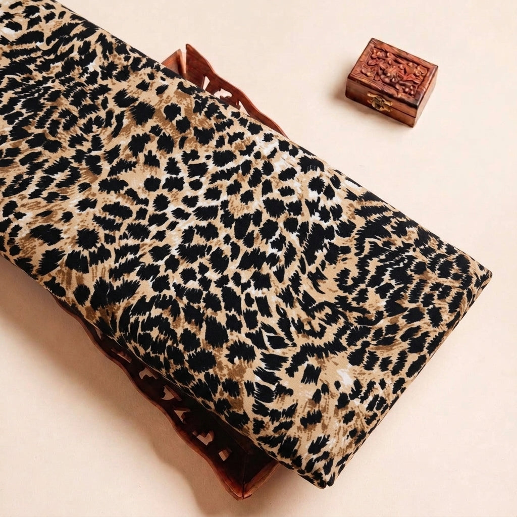 Folded Brown Animal Print Crepe Fabric Highlighting Texture