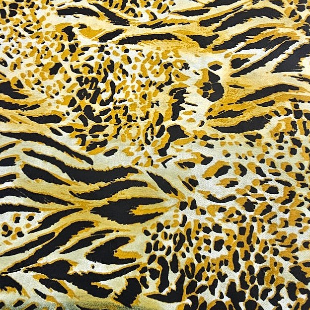 Yellow Animal Print Crepe Fabric, laid flat