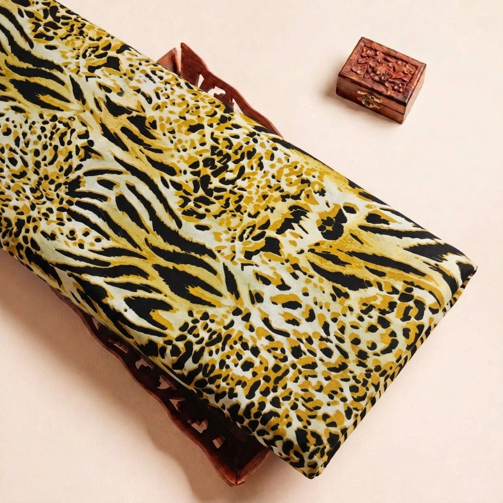 Folded Yellow Animal Print Crepe Fabric Highlighting Texture