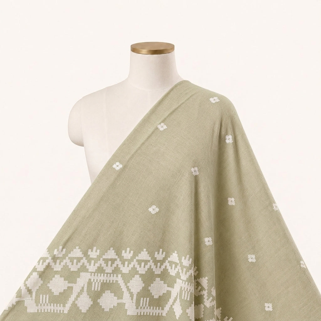 Beige Ikat Cotton Fabric Draped as a saree