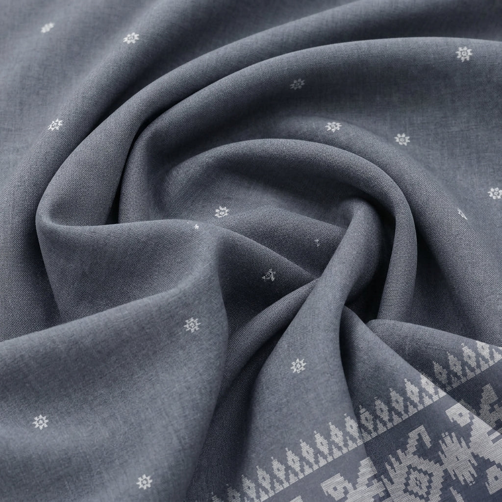 Swirled Grey Ikat Cotton Fabric Showing Border and Drape