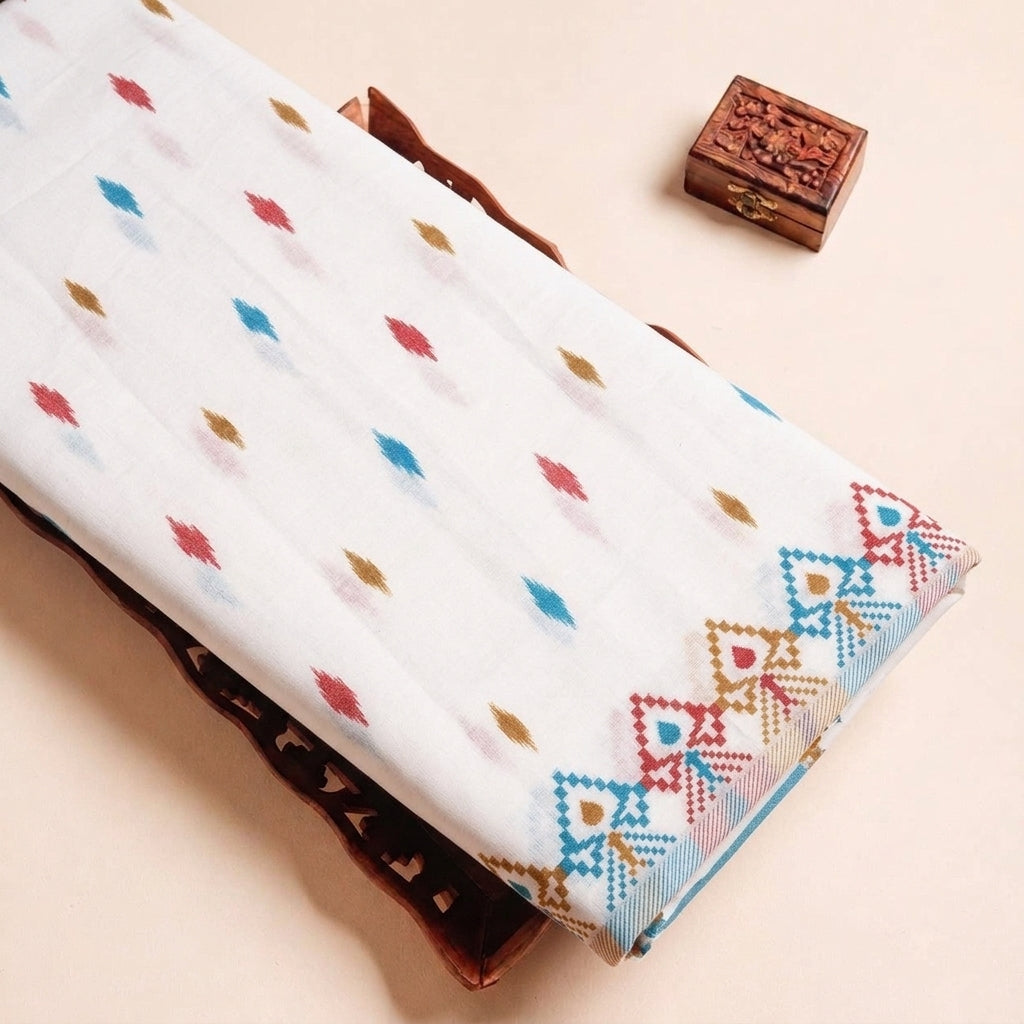 Folded White Ikat Cotton Fabric Highlighting Border and Texture