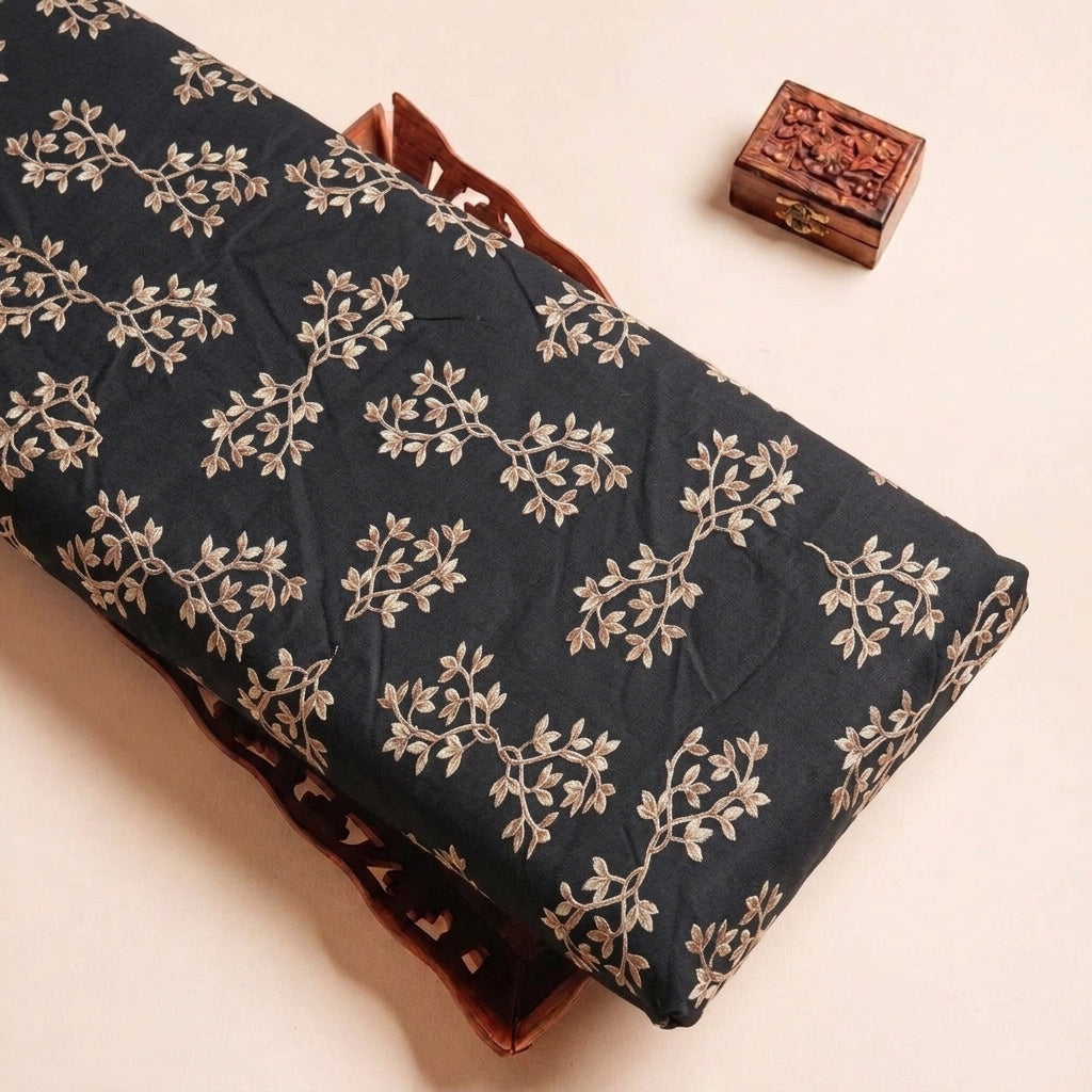 Folded Black Floral Rayon Fabric Highlighting Texture