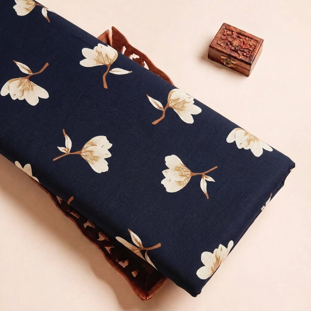 Folded Black Floral Rayon Fabric Highlighting Texture