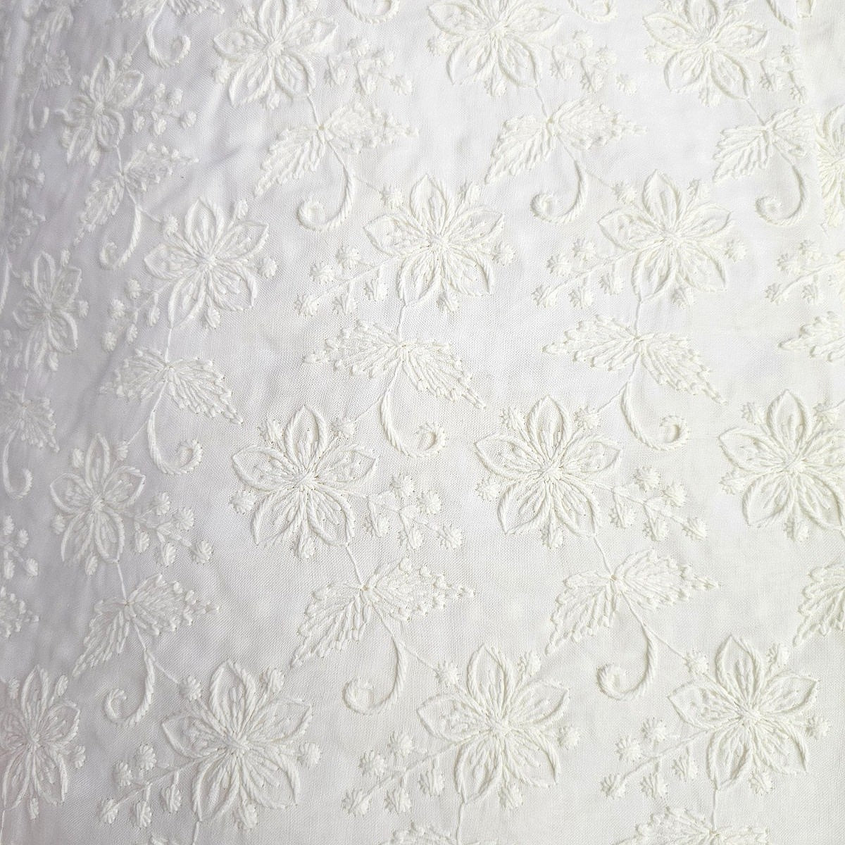 Cream Embroidery Cotton Fabric, laid flat