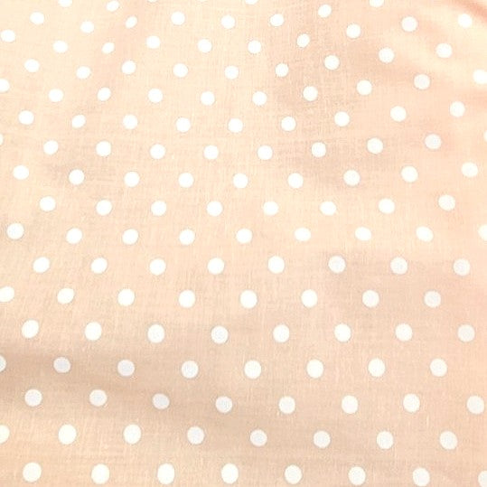 Light Peach Polka Dots Cotton Fabric, laid flat
