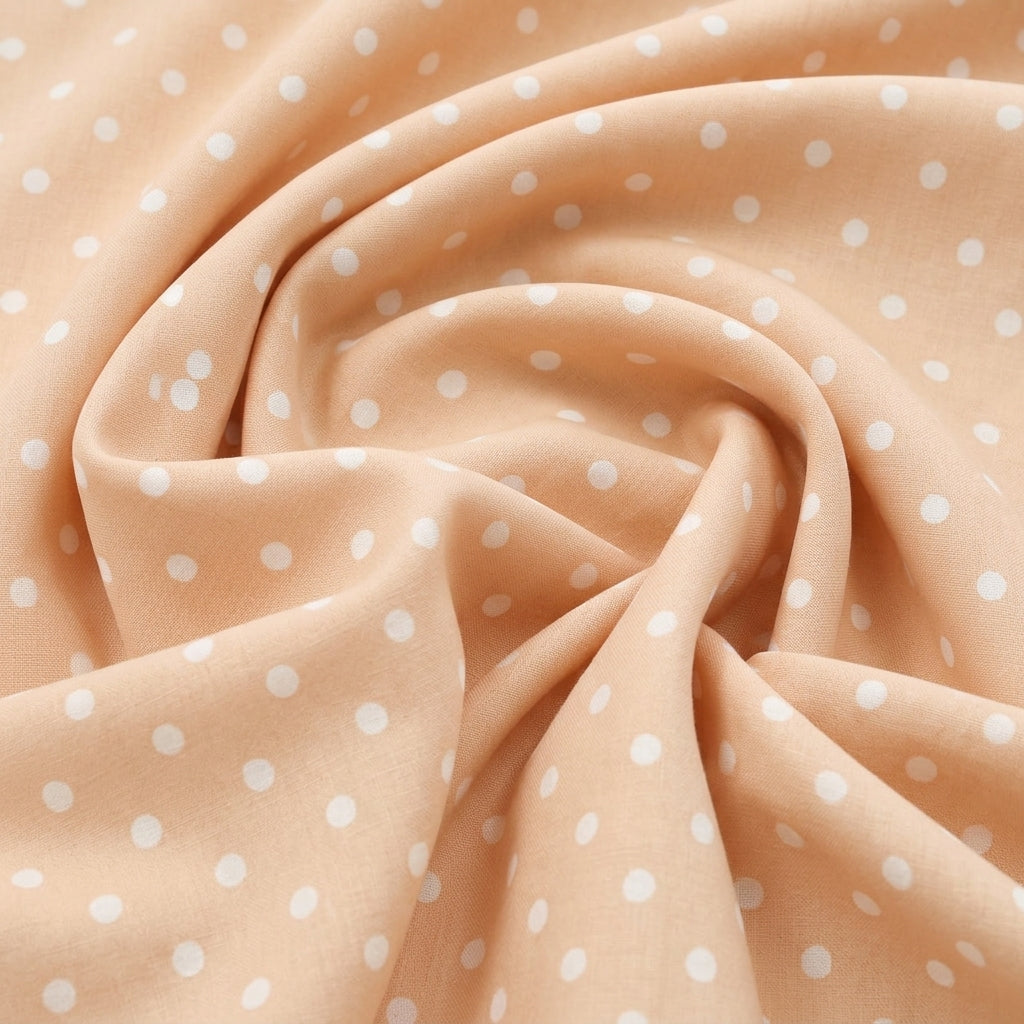 Swirled Light Peach Polka Dots Cotton Fabric Showing Drape