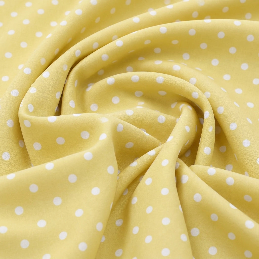 Swirled Yellow Polka Dots Cotton Fabric Showing Drape