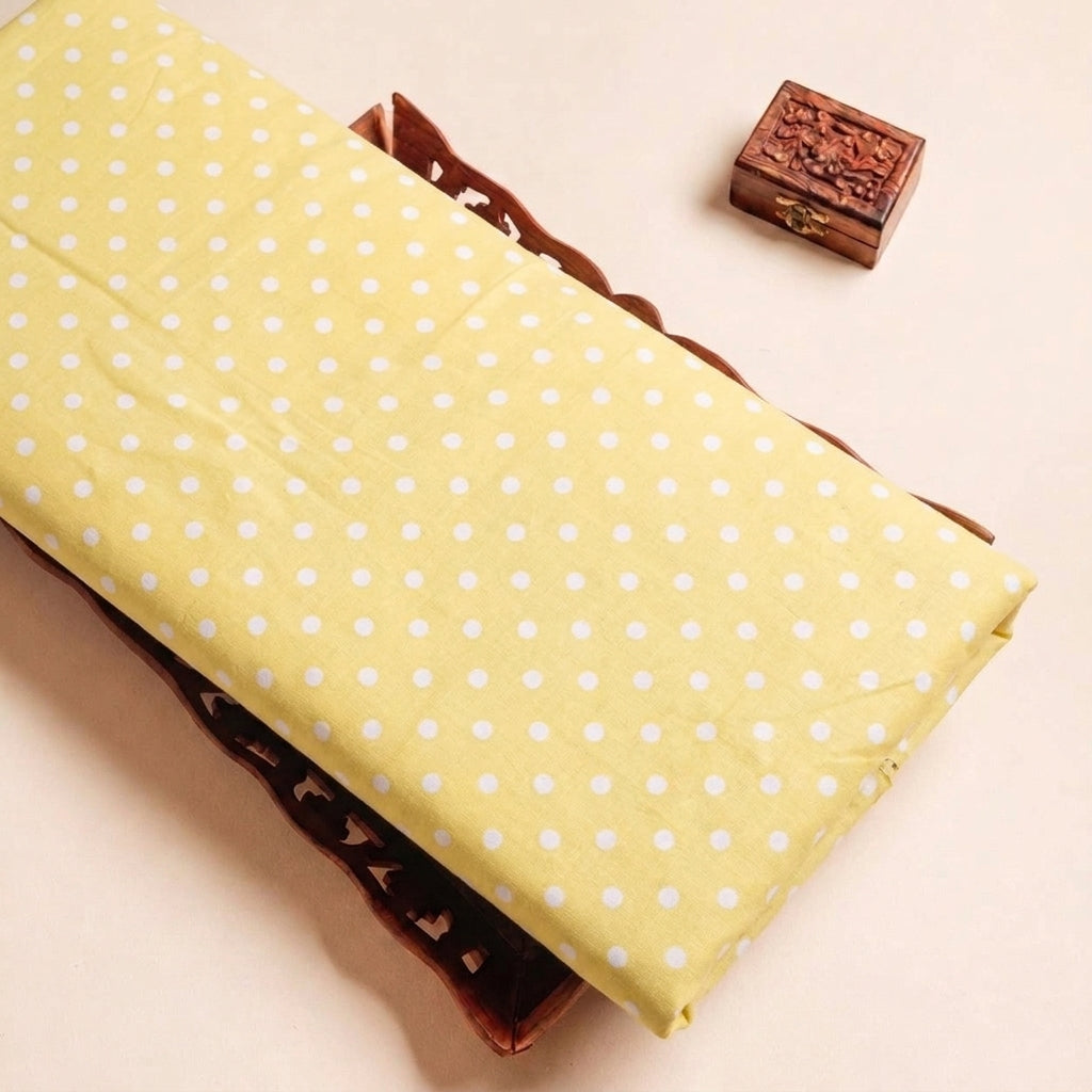 Folded Yellow Polka Dots Cotton Fabric Highlighting Texture