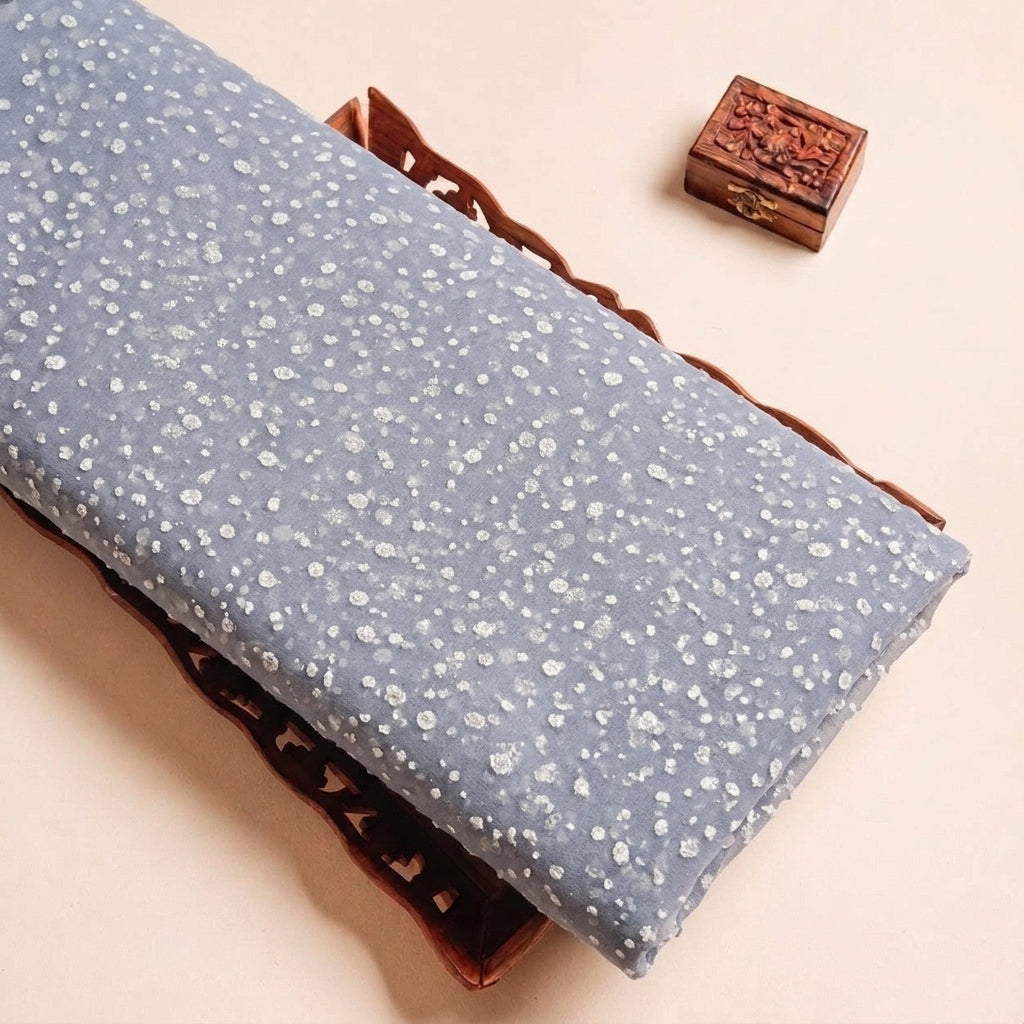 Folded Grey Butta Organza Fabric Highlighting Dusted Glitter and Texture
