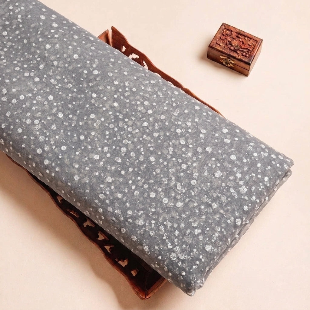 Folded Light Grey Butta Organza Fabric Highlighting Dusted Glitter and Texture