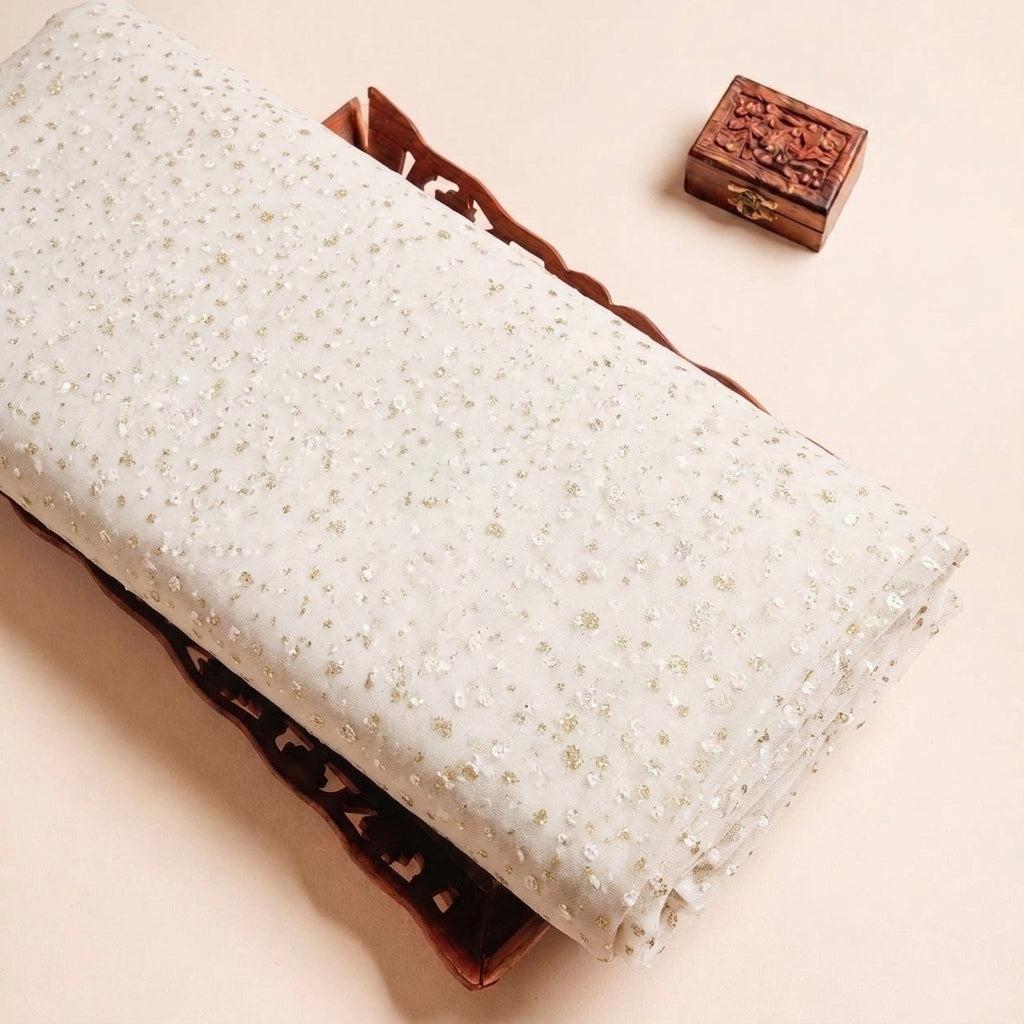Folded Cream Butta Organza Fabric Highlighting Dusted Glitter and Texture
