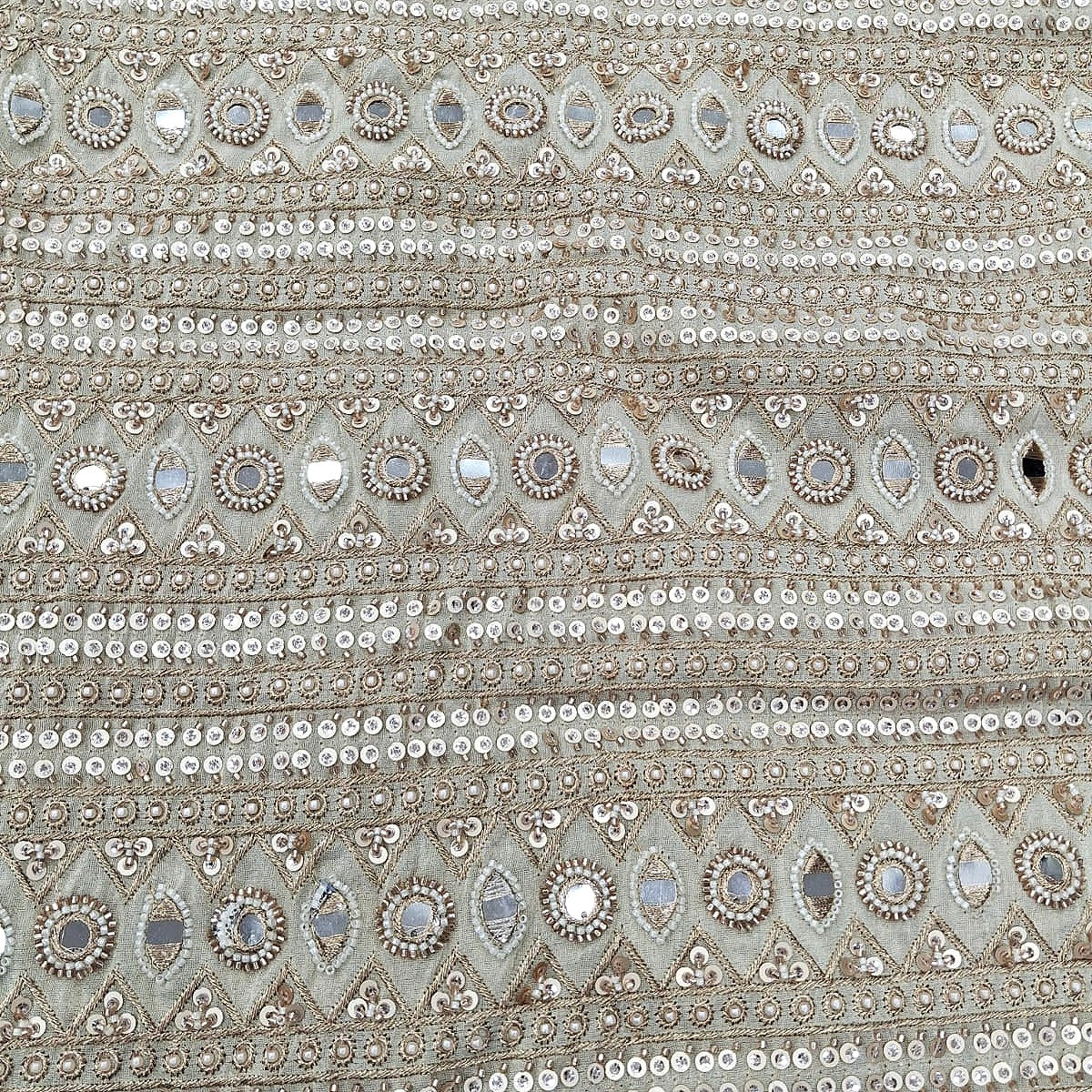 Cream Embroidery Tissue Fabric, laid flat