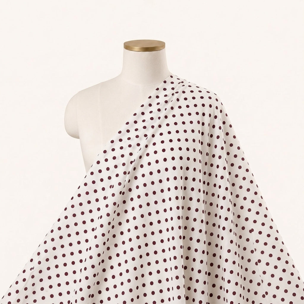 Brown White Polka Dots Cotton Fabric, draped as a saree