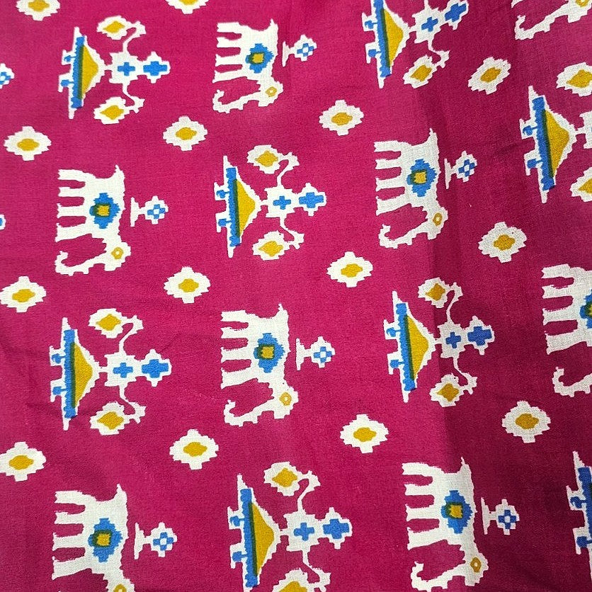 Pink Patola Print Cotton Fabric, laid flat