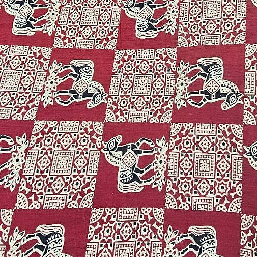 Maroon Printed Cotton Fabric, laid flat