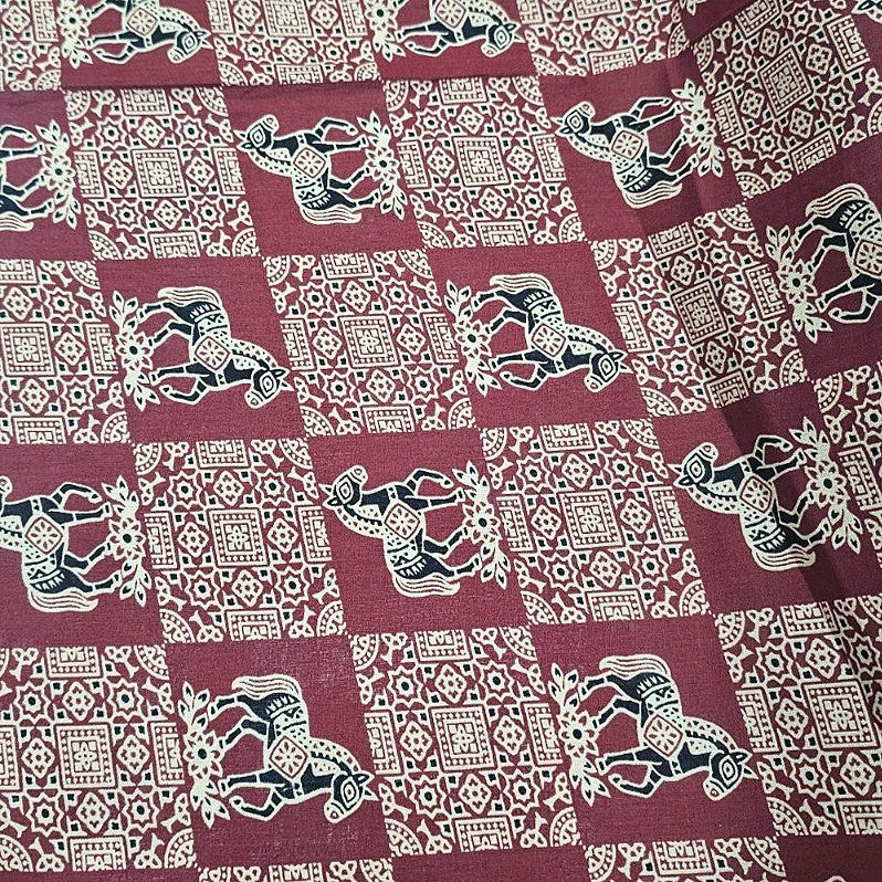 Maroon Printed Cotton Fabric, laid flat