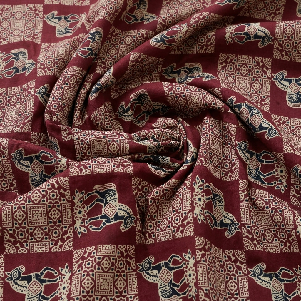 Swirled Maroon Printed Cotton Fabric Showing Drape