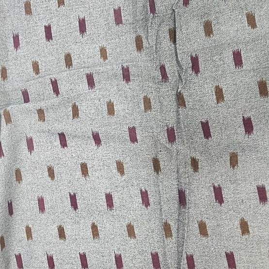 Orangee Ikat Cotton Fabric, laid flat