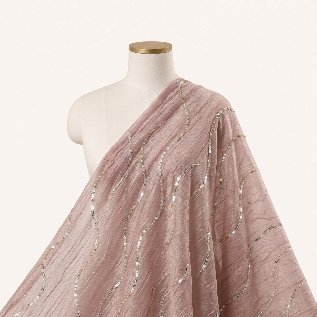 Peach Gold Embroidery Organza Fabric Draped as a saree