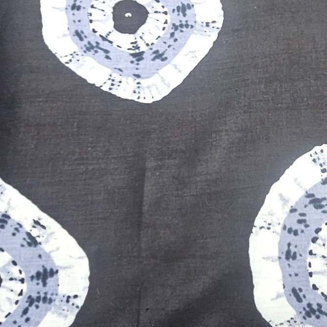 Black Bandhini Cotton Fabric, laid flat
