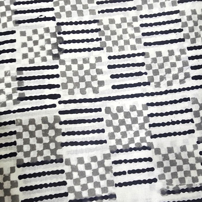 White Hand block Cotton Fabric, laid flat