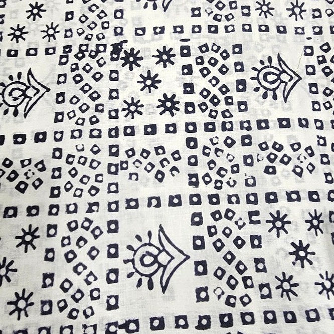 White Hand Block Cotton Fabric, laid flat