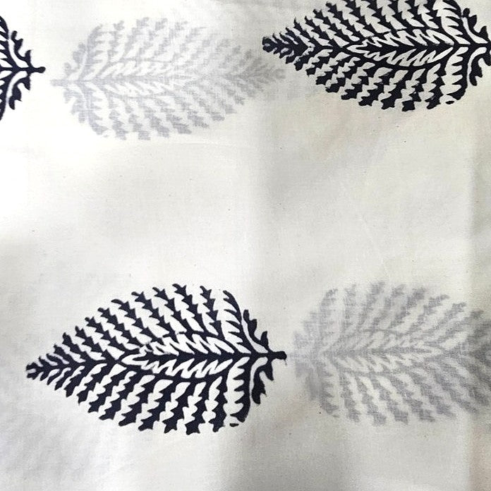White Hand Block Cotton Fabric, laid flat