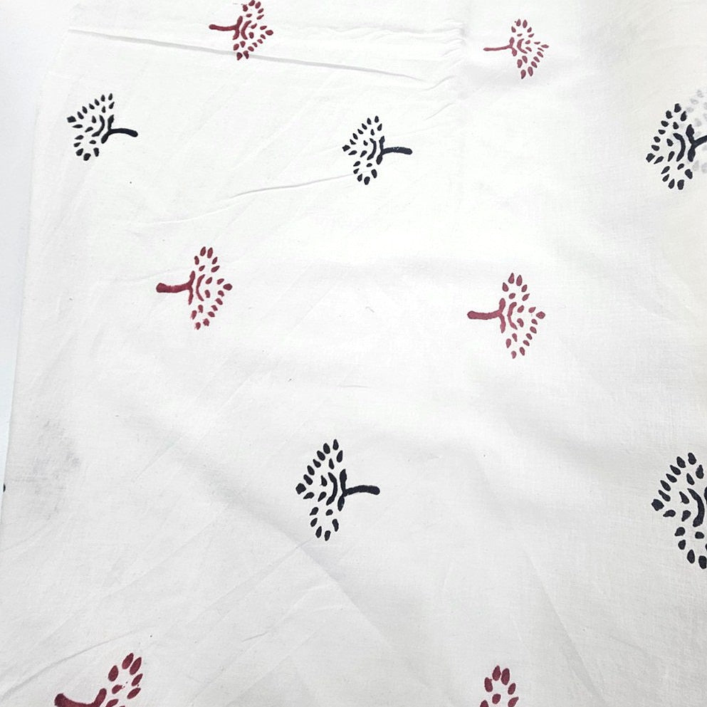 White Hand block Cotton Fabric, laid flat