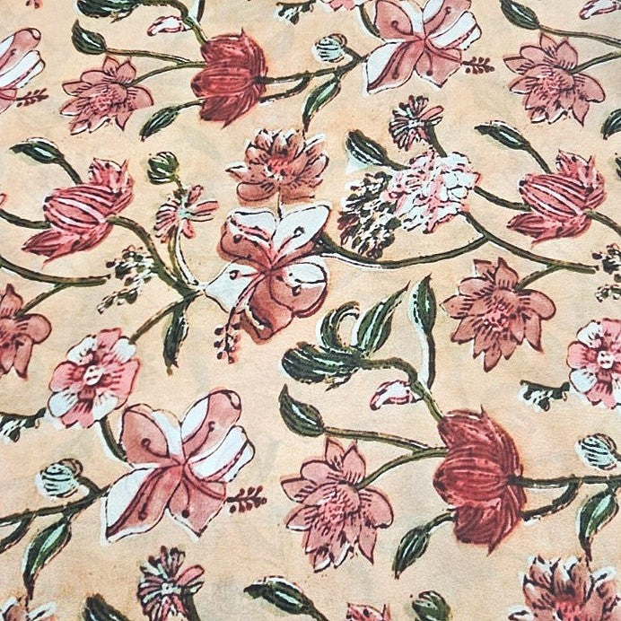 Peach Floral Viscose Georgette Fabric, laid flat
