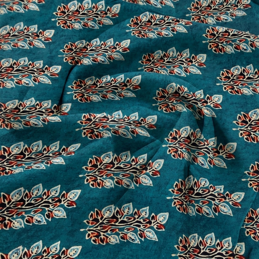 Swirled Teal Floral Viscose Georgette Fabric Showing Drape