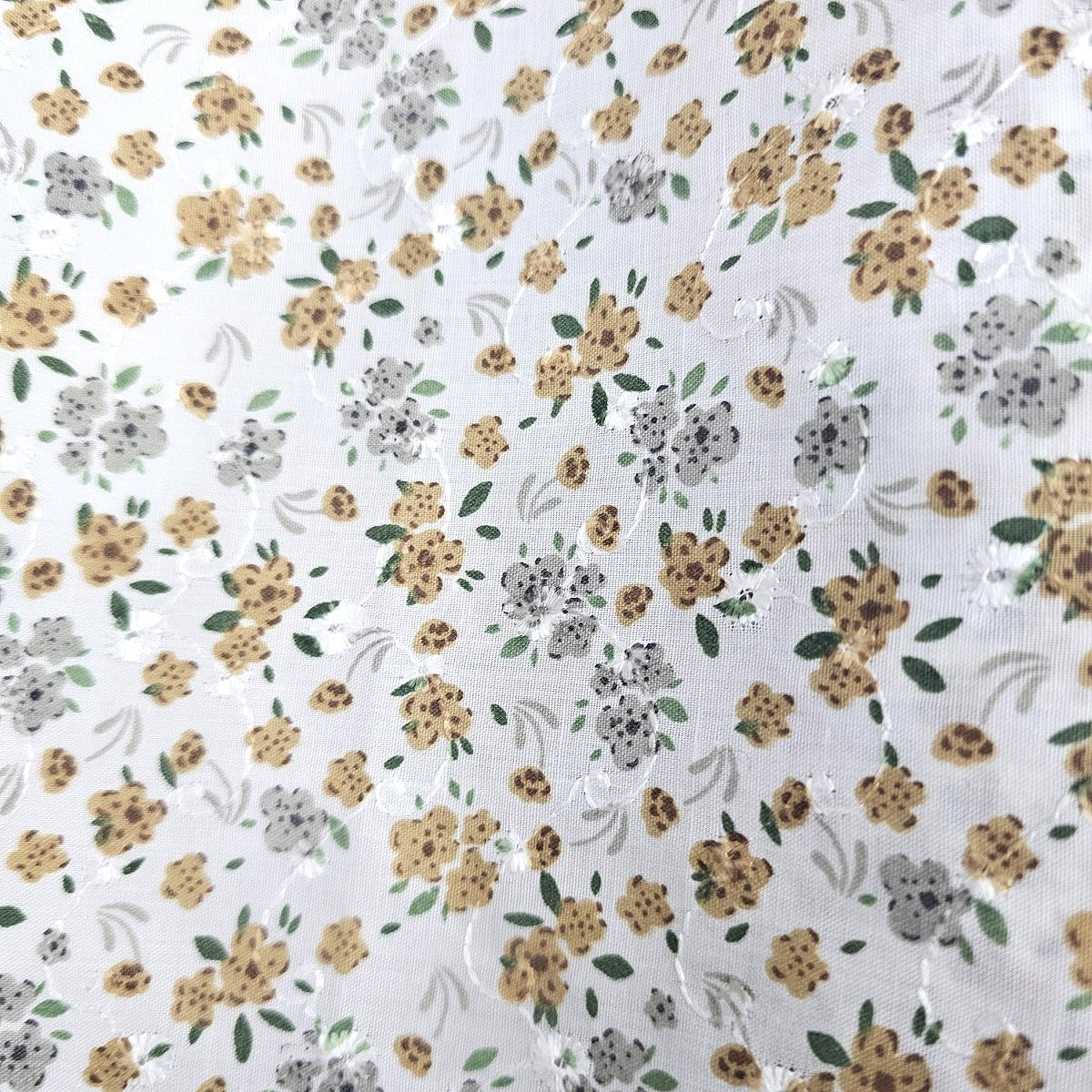 White Embroidery Cotton Fabric, laid flat
