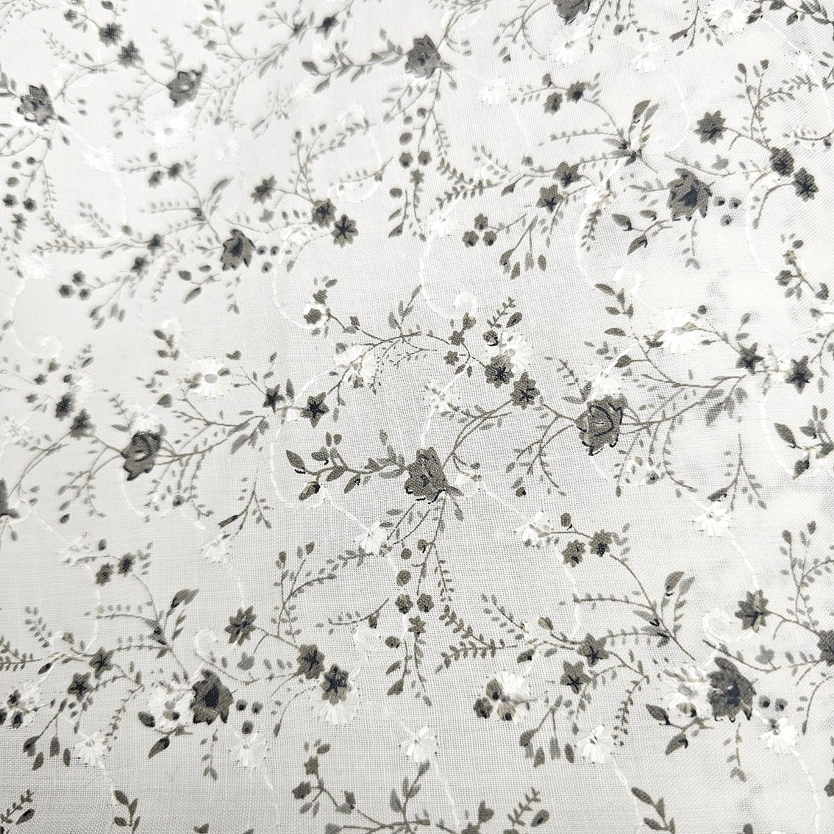 White Embroidery Cotton Fabric, laid flat