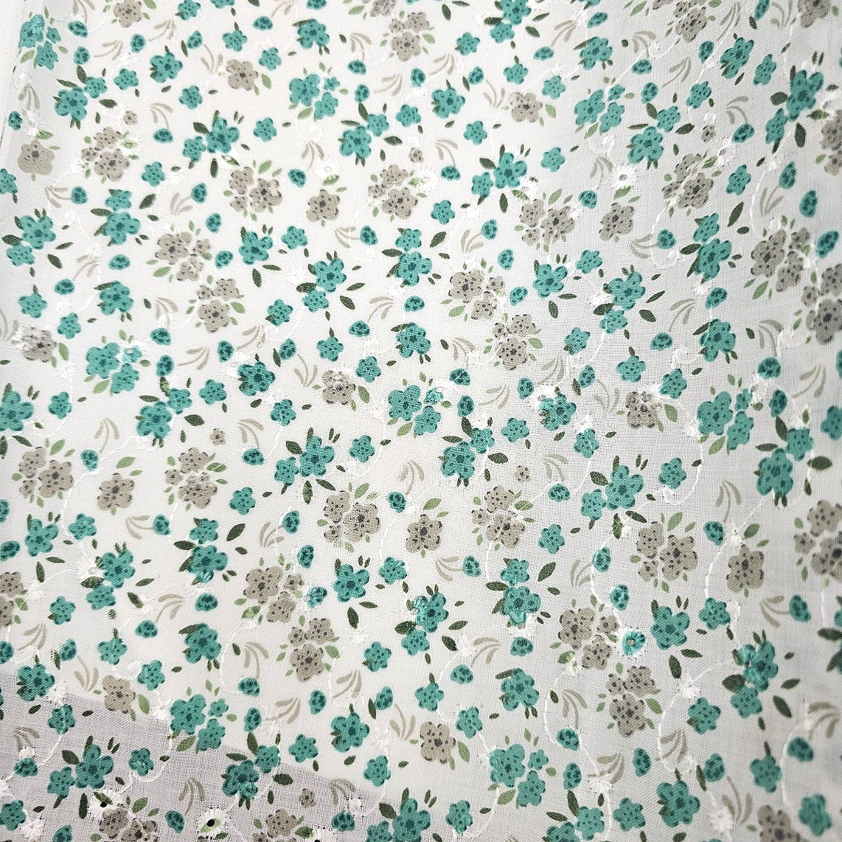 White Embroidery Cotton Fabric, laid flat